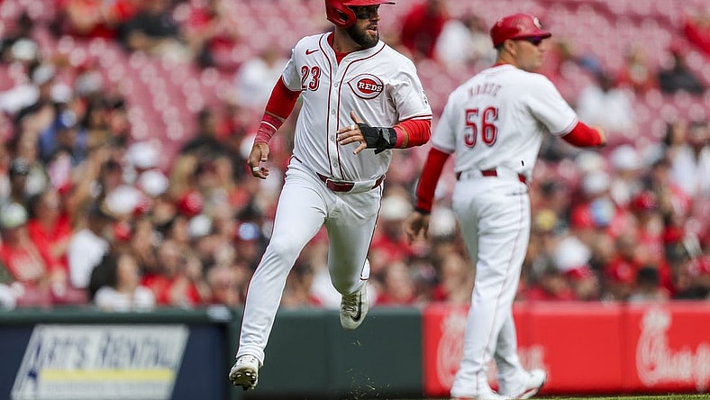 Mar 31, 2024; Cincinnati, Ohio, USA; Cincinnati Reds designated hitter Nick Martini (23) scores on a double hit by center fielder Will Benson (30) in the third inning against the Washington Nationals at Great American Ball Park. Mandatory Credit: Katie Stratman-USA TODAY Sports