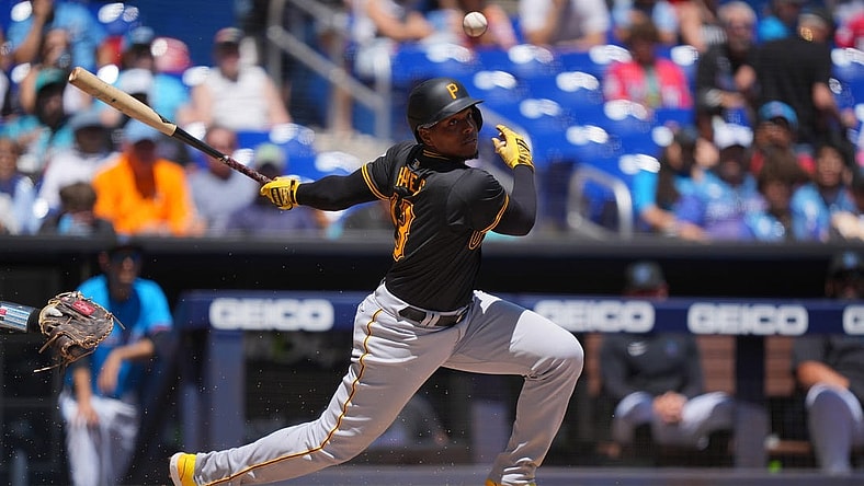 Mar 31, 2024; Miami, Florida, USA;  Pittsburgh Pirates third baseman Ke'Bryan Hayes (13) hits a short ground ball in the first inning against the Miami Marlins at loanDepot Park. Mandatory Credit: Jim Rassol-USA TODAY Sports