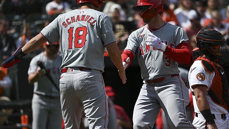 Mar 31, 2024; Baltimore, Maryland, USA;  Los Angeles Angels left fielder Taylor Ward (3) celebrates with  first baseman Nolan Schanuel (18) at home plate after hitting a first inning home run H| at Oriole Park at Camden Yards. Mandatory Credit: Tommy Gilligan-USA TODAY Sports