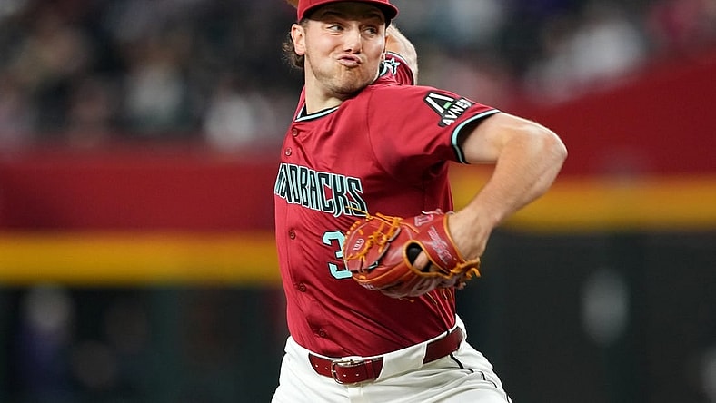Mar 31, 2024; Phoenix, Arizona, USA; Arizona Diamondbacks starting pitcher Brandon Pfaadt (32) pitches against the Colorado Rockies during the fourth inning at Chase Field. Mandatory Credit: Joe Camporeale-USA TODAY Sports