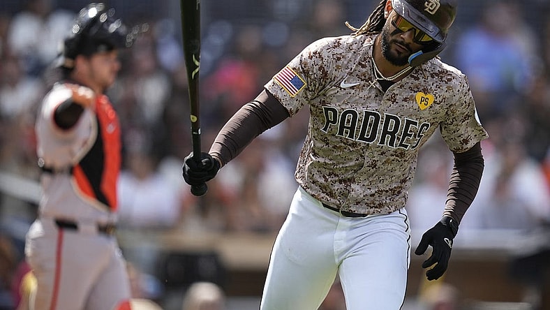Mar 31, 2024; San Diego, California, USA; San Diego Padres right fielder Fernando Tatis Jr. (23) tosses his bat after hitting a ground ball during the fourth inning against the San Francisco Giants at Petco Park. Mandatory Credit: Ray Acevedo-USA TODAY Sports