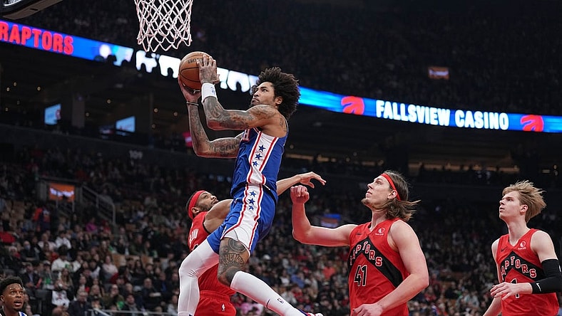 Mar 31, 2024; Toronto, Ontario, CAN; Philadelphia 76ers guard Kelly Oubre Jr. (9) drives to the basket over Toronto Raptors forward Kelly Olynyk (41) during the first quarter at Scotiabank Arena. Mandatory Credit: Nick Turchiaro-USA TODAY Sports