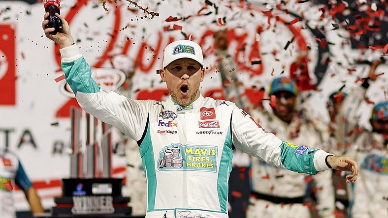 Mar 31, 2024; Richmond, Virginia, USA; NASCAR Cup Series driver Denny Hamlin (11) celebrates winning the Toyota Owners 400 at Richmond Raceway. Mandatory Credit: Peter Casey-USA TODAY Sports