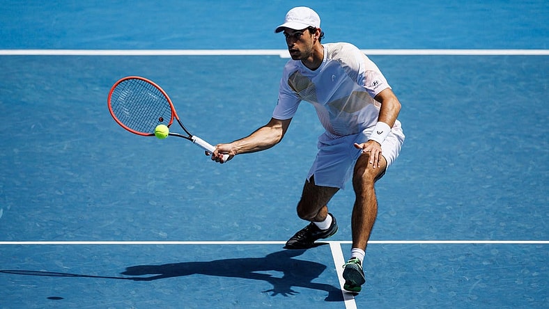 Jan 22, 2024; Melbourne, Victoria, Australia; Nuno Borges of Portugal hits a shot against Daniil Medvedev of Russia in the fourth round of the men   s singles at the Australian Open in MelbourneMandatory Credit: Mike Frey-USA TODAY Sports