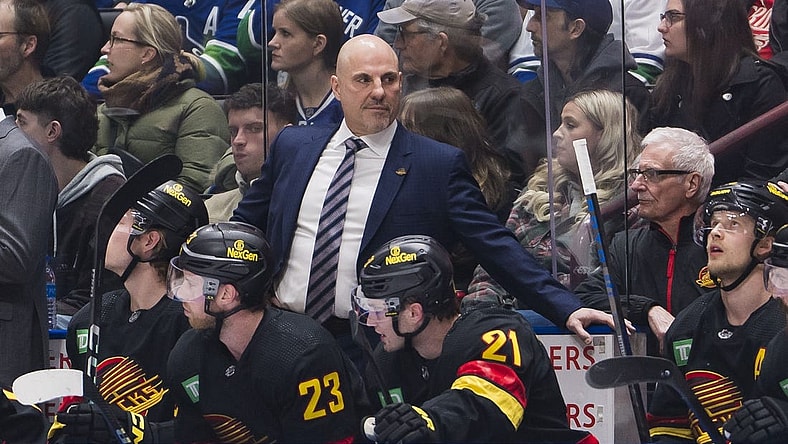 Feb 15, 2024; Vancouver, British Columbia, CAN; Vancouver Canucks head coach Rick Tocchet on the bench against the Detroit Red Wings in the first period at Rogers Arena. Mandatory Credit: Bob Frid-USA TODAY Sports