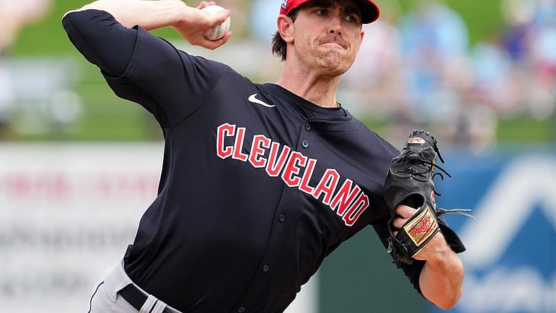 Mar 12, 2024; Surprise, Arizona, USA; Cleveland Guardians starting pitcher Shane Bieber (57) bats against the Texas Rangers during the second inning at Surprise Stadium. Mandatory Credit: Joe Camporeale-USA TODAY Sports