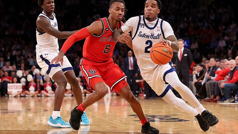 Mar 14, 2024; New York City, NY, USA; Seton Hall Pirates guard Al-Amir Dawes (2) drives to the basket against St. John's Red Storm guard Daniss Jenkins (5) during the second half at Madison Square Garden. Mandatory Credit: Brad Penner-USA TODAY Sports