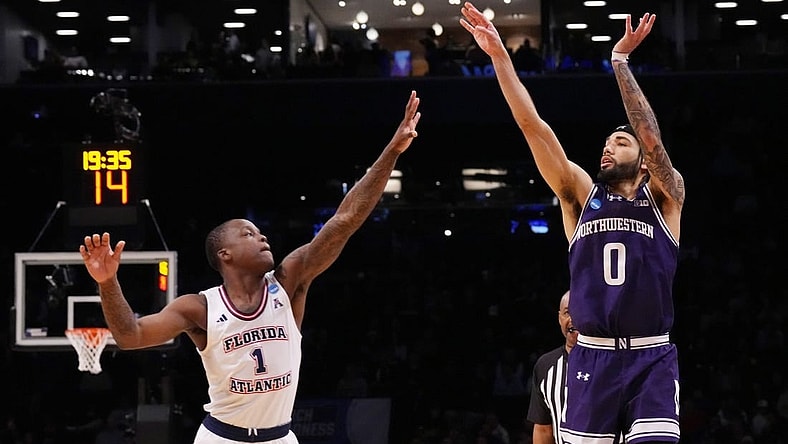 March 22, 2024, Brooklyn, NY, USA; Northwestern Wildcats guard Boo Buie (0) shoots over Florida Atlantic Owls guard Johnell Davis (1)  in the first round of the 2024 NCAA Tournament at the Barclays Center. Mandatory Credit: Robert Deutsch-USA TODAY Sports