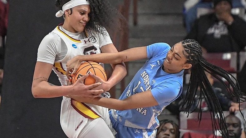 Mar 24, 2034; Columbia, So Carolina, USA;  South Carolina center Kamilla Cardoso (10) and University of North Carolina guard Teonni Key (13) try to get a rebound during the second quarter of the second round NCAA Women's Basketball Tournament game at the Colonial Life Center.  Mandatory Credit: Ken Ruinard-USA TODAY Sports via Greenville News