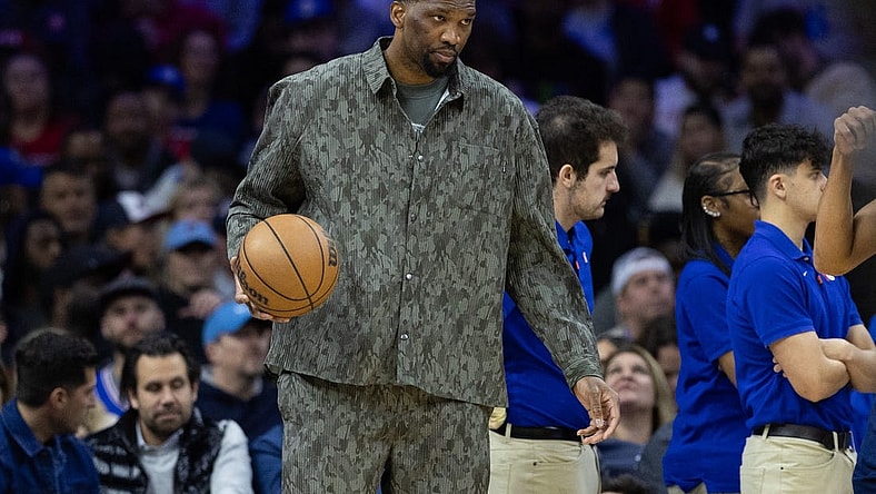 Mar 27, 2024; Philadelphia, Pennsylvania, USA; Injured Philadelphia 76ers center Joel Embiid dribbles the ball during a timeout in the second quarter against the LA Clippers at Wells Fargo Center. Mandatory Credit: Bill Streicher-USA TODAY Sports