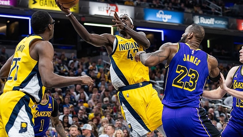 Mar 29, 2024; Indianapolis, Indiana, USA; Indiana Pacers forward Pascal Siakam (43) shoots the ball while Los Angeles Lakers forward LeBron James (23) defends in the first half at Gainbridge Fieldhouse. Mandatory Credit: Trevor Ruszkowski-USA TODAY Sports