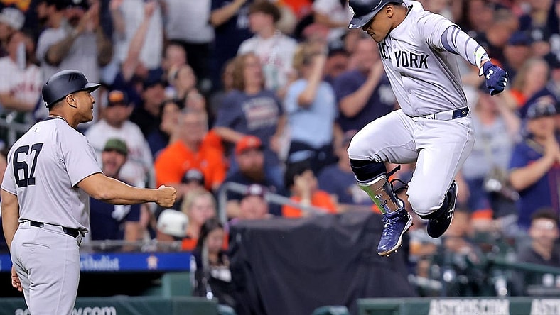 Mar 30, 2024; Houston, Texas, USA; New York Yankees right fielder Juan Soto (22, right) reacts after hitting a home run to left field against the Houston Astros during the seventh inning at Minute Maid Park. Mandatory Credit: Erik Williams-USA TODAY Sports