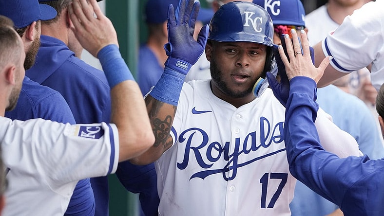 Mar 31, 2024; Kansas City, Missouri, USA; Kansas City Royals right fielder Nelson Velazquez (17) is congratulated in the dugout against the Minnesota Twins after hitting a solo home run in the sixth inning at Kauffman Stadium. Mandatory Credit: Denny Medley-USA TODAY Sports