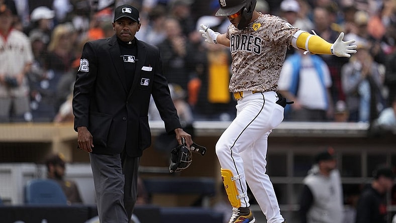Mar 31, 2024; San Diego, California, USA; San Diego Padres shortstop Ha-Seong Kim (7) reacts after hitting a home run against the San Francisco Giants during the second inning at Petco Park. Mandatory Credit: Ray Acevedo-USA TODAY Sports