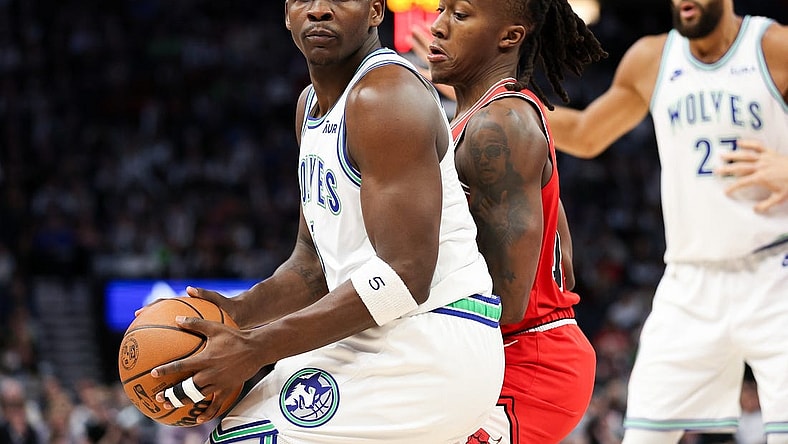 Mar 31, 2024; Minneapolis, Minnesota, USA; Minnesota Timberwolves guard Anthony Edwards (5) works around Chicago Bulls guard Ayo Dosunmu (12) during the first half at Target Center. Mandatory Credit: Matt Krohn-USA TODAY Sports
