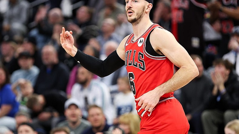 Mar 31, 2024; Minneapolis, Minnesota, USA; Chicago Bulls guard Alex Caruso (6) celebrates his three-point basket against the Minnesota Timberwolves during the second half at Target Center. Mandatory Credit: Matt Krohn-USA TODAY Sports