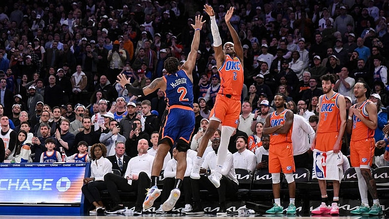 Mar 31, 2024; New York, New York, USA; Oklahoma City Thunder guard Shai Gilgeous-Alexander (2) hits the game winning basket with 1.8 seconds remaining in the fourth quarter while being defended by New York Knicks guard Miles McBride (2) at Madison Square Garden. Mandatory Credit: John Jones-USA TODAY Sports
