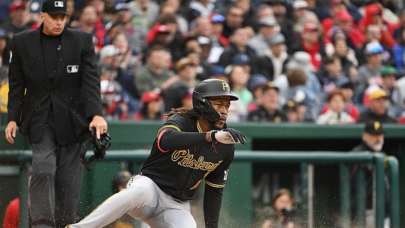 Apr 1, 2024; Washington, District of Columbia, USA; Pittsburgh Pirates shortstop Oneil Cruz (15) slides into home to score a run against the Washington Nationals at Nationals Park. Mandatory Credit: Rafael Suanes-USA TODAY Sports