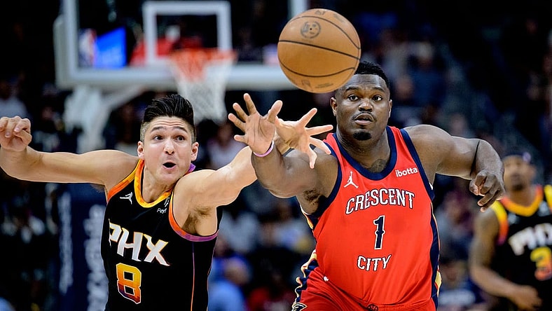 Apr 1, 2024; New Orleans, Louisiana, USA; New Orleans Pelicans forward Zion Williamson (1) battles Phoenix Suns guard Grayson Allen (8) for the ball during the first quarter at Smoothie King Center. Mandatory Credit: Matthew Hinton-USA TODAY Sports