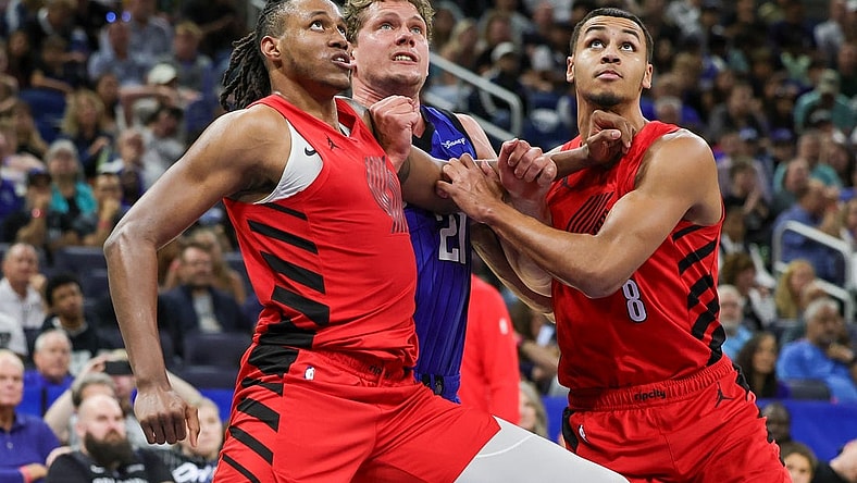 Apr 1, 2024; Orlando, Florida, USA; Portland Trail Blazers forward Jabari Walker (34) forward Kris Murray (8) and Orlando Magic center Moritz Wagner (21) look for the rebound during the second half at Amway Center. Mandatory Credit: Mike Watters-USA TODAY Sports