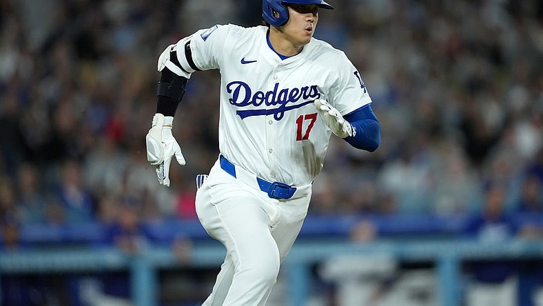 Apr 1, 2024; Los Angeles, California, USA; Los Angeles Dodgers designated hitter Shohei Ohtani (17) rounds the bases on a double in the third inning against the San Francisco Giants at Dodger Stadium. Mandatory Credit: Kirby Lee-USA TODAY Sports