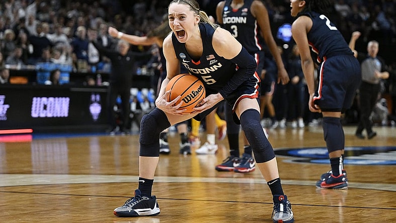UConn Huskies guard Paige Bueckers (5) celebrates after beating the USC Trojans in the finals of the Portland Regional of the NCAA Tournament at the Moda Center. Mandatory Credit: Troy Wayrynen-USA TODAY Sports