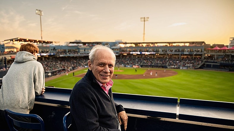 Larry Lucchino, pictured here in a 2023 photo at Polar Park in Worcester, Mass., was a driving force behind the construction or renovation of five baseball stadiums during his 27-year association with the game.