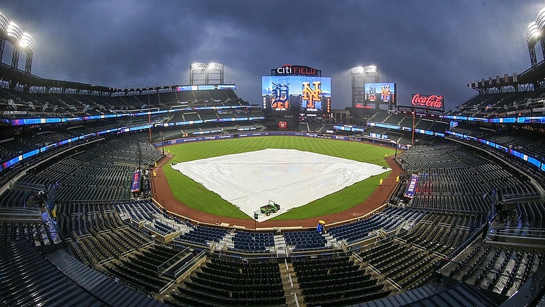 Apr 2, 2024; New York City, New York, USA;  The tarp is placed on the field during a rain delay prior to the game between the Detroit Tigers and the New York Mets at Citi Field. Mandatory Credit: Wendell Cruz-USA TODAY Sports