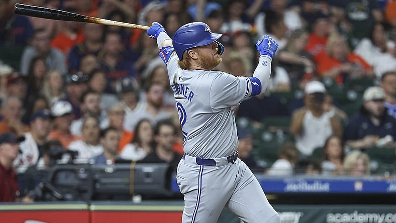 Apr 2, 2024; Houston, Texas, USA; Toronto Blue Jays designated hitter Justin Turner (2) hits a single during the seventh inning against the Houston Astros at Minute Maid Park. Mandatory Credit: Troy Taormina-USA TODAY Sports