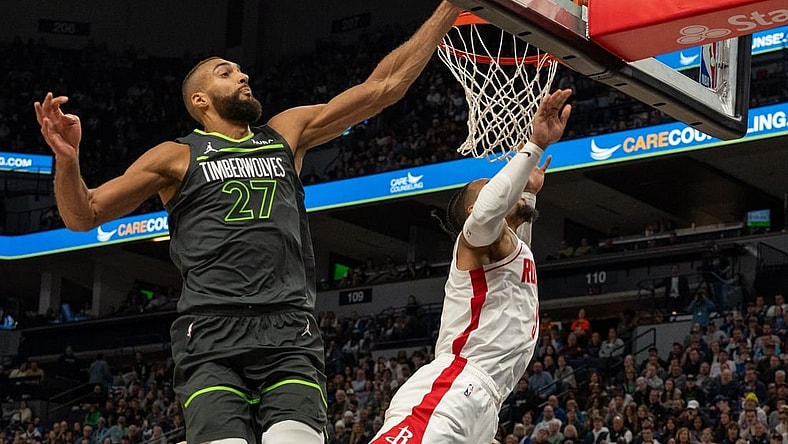Apr 2, 2024; Minneapolis, Minnesota, USA; Minnesota Timberwolves center Rudy Gobert (27) blocks a shot by Houston Rockets forward Dillon Brooks (9) in the fourth quarter at Target Center. Mandatory Credit: Matt Blewett-USA TODAY Sports
