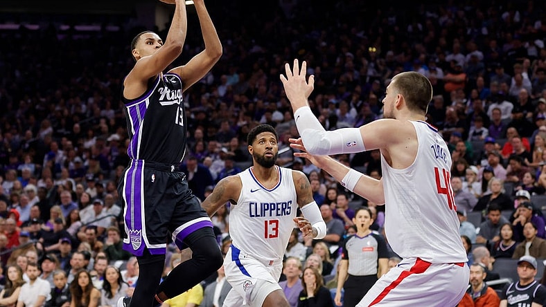 Apr 2, 2024; Sacramento, California, USA; Sacramento Kings forward Keegan Murray (13) shoots the ball over LA Clippers center Ivica Zubac (40) during the second quarter at Golden 1 Center. Mandatory Credit: Sergio Estrada-USA TODAY Sports