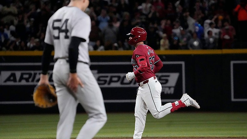 Arizona Diamondbacks first baseman Christian Walker (53) rounds the bases after hitting a three-run home run against New York Yankees pitcher Jake Cousins (54) during the seventh inning at Chase Field in Phoenix on April 2, 2024.