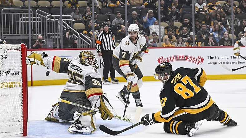 PITTSBURGH, PA - MARCH 11: Pittsburgh Penguins center Sidney Crosby (87) scores a goal against Vegas Golden Knights goaltender Ilya Samsonov (35) during the first period in the NHL game between the Pittsburgh Penguins and the Vegas Golden Knights on March 11, 2025, at PPG Paints Arena in Pittsburgh, PA. (Photo by Jeanine Leech/Icon Sportswire)