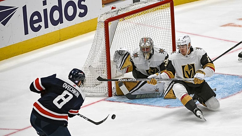 WASHINGTON, DC - NOVEMBER 01: Washington Capitals left wing Alex Ovechkin (8) fires a shot that is saved by Vegas Golden Knights defenseman Zach Whitecloud (2) and goaltender Logan Thompson (36) during the Las Vegas Golden Knights game versus the Washington Capitals on November 1, 2022 at the Capital One Arena in Washington, D.C. (Photo by Mark Goldman/Icon Sportswire)