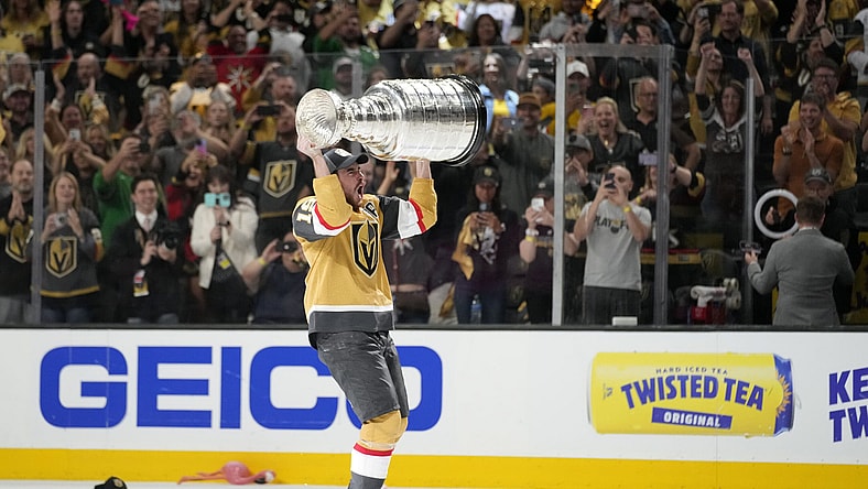 Vegas Golden Knights right wing Reilly Smith skates with the Stanley Cup after the Knights defeated the Florida Panthers 9-3 in Game 5 of the NHL hockey Stanley Cup Finals Tuesday, June 13, 2023, in Las Vegas. The Knights won the series 4-1. (AP Photo/John Locher)