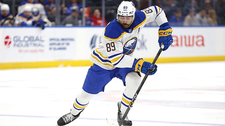 Buffalo Sabres right wing Alex Tuch (89) skates with the puck during the third period of an NHL hockey game against the New York Islanders, Saturday, Nov. 30, 2024, in Elmont, N.Y. (AP Photo/Noah K. Murray)