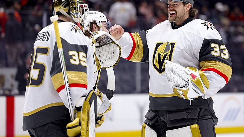 Vegas Golden Knights goaltender Ilya Samsonov, left, celebrates with goaltender Adin Hill after the team's win against the Anaheim Ducks during an NHL hockey game Wednesday, Dec. 4, 2024, in Anaheim, Calif. (AP Photo/Ryan Sun)