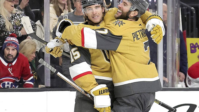 Vegas Golden Knights defenseman Noah Hanifin (15) celebrates with Vegas Golden Knights defenseman Alex Pietrangelo (7) after scoring a goal against the Montreal Canadiens during the first period of an NHL hockey game Tuesday, Dec. 31, 2024, in Las Vegas. (Steve Marcus/Las Vegas Sun via AP)