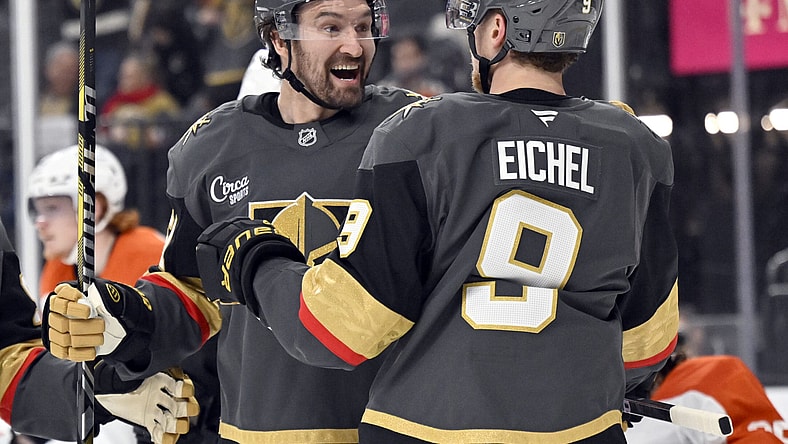 Vegas Golden Knights right wing Mark Stone, left, celebrates with center Jack Eichel (9) after scoring against the Philadelphia Flyers during the second period of an NHL hockey game Thursday, Jan. 2, 2025, in Las Vegas. (AP Photo/David Becker)