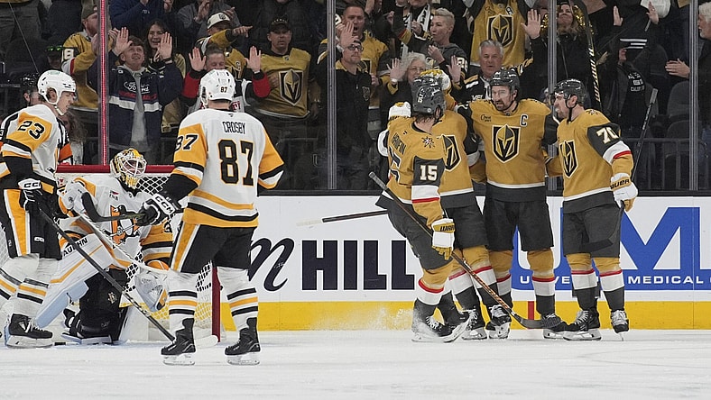 Vegas Golden Knights right wing Mark Stone, second from right, celebrates after scoring against the Pittsburgh Penguins during the third period of an NHL hockey game Friday, March 7, 2025, in Las Vegas. (AP Photo/John Locher)