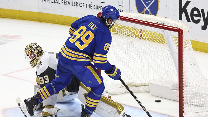 Buffalo Sabres right wing Alex Tuch (89) puts the puck past Vegas Golden Knights goaltender Adin Hill (33) for the game winning goal during a shootout in an NHL hockey game Saturday, March 15, 2025, in Buffalo, N.Y. (AP Photo/Jeffrey T. Barnes)