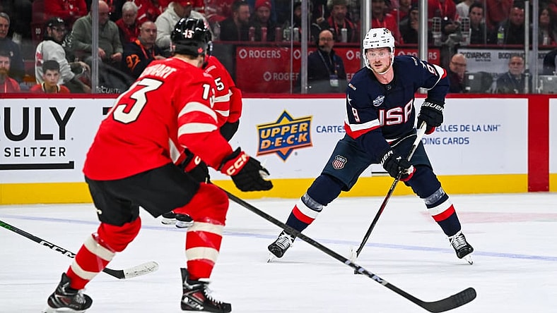 MONTREAL, QC - FEBRUARY 15: Team USA forward Jack Eichel (9) plays the puck against Team Canada forward Sam Reinhart (13) during a 4 Nations Face-Off game between Team USA and Team Canada on February 15, 2025, at Bell Centre in Montreal, QC (Photo by David Kirouac/Icon Sportswire)
