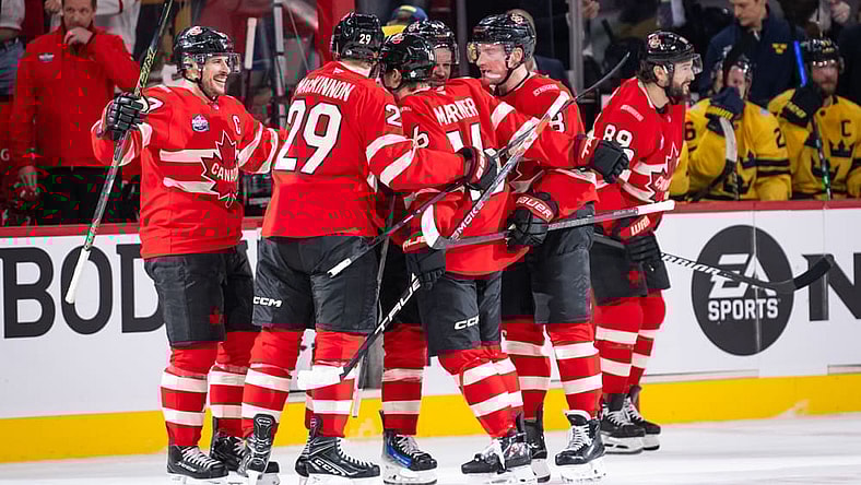 Mitch Marner (16) of Team Canada celebrates with teammates after scoring a goal during the (OT) period of the 4 Nations Face-Off game between Canada and Sweden on February 12, 2025, at Bell Centre in Montreal, Quebec