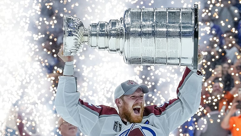TAMPA, FL - JUNE 26: Colorado Avalanche left wing Gabriel Landeskog (92) Team Captain receives the Stanley Cup Trophy during the NHL Hockey Stanley Cup Finals Game six between Tampa Bay Lightning and the Colorado Avalanche on June 26th, 2022 at Amalie Arena in Tampa Florida (Photo by Andrew Bershaw /Icon_Sportswire)