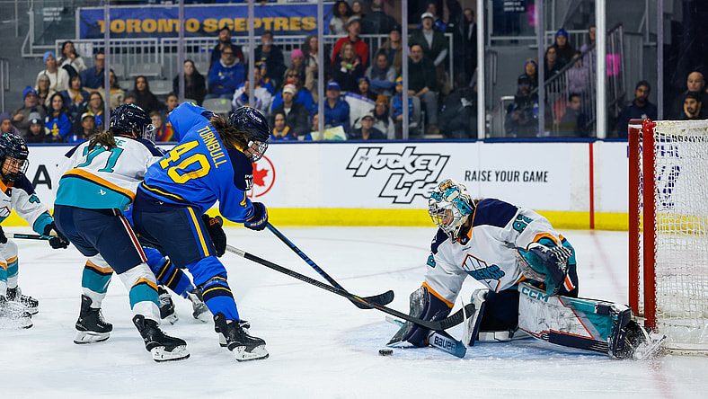 New York Sirens goalie Kayle Osborne makes a save on Toronto Sceptres forward Blayre Turnbull.