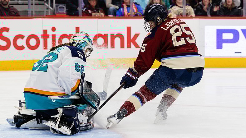 New York Sirens goalie Kayle Osborne denies Montreal Victoire forward Lina Ljungblom.