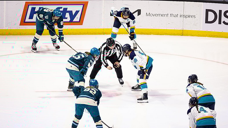New York Sirens forward Sarah Fillier and Seattle Torrent forward Alex Carpenter take a faceoff in Chicago.