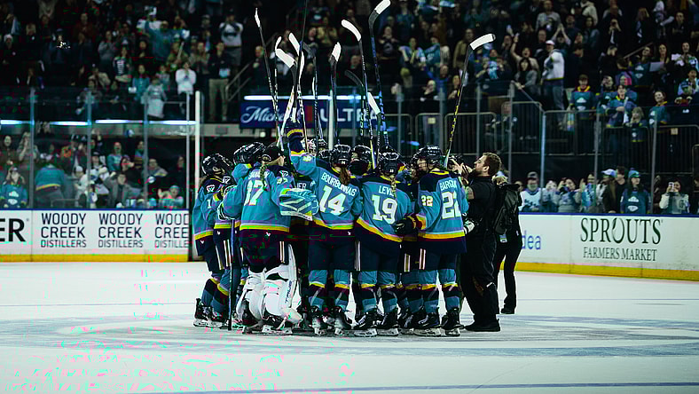 The New York Sirens huddle at center ice to celebrate a 2-1 shootout win over the Seattle Torrent at Madison Square Garden.