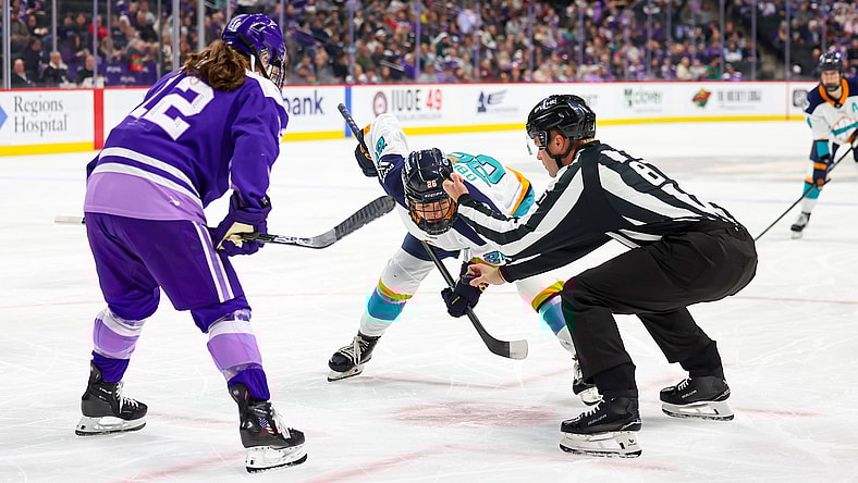 New York Sirens rookie center Casey O'Brien takes a faceoff against Minnesota Frost alternate captain Kelly Pannek.