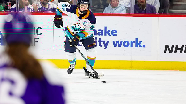 New York Sirens captain Micah Zandee-Hart carries the puck against the Minnesota Frost.